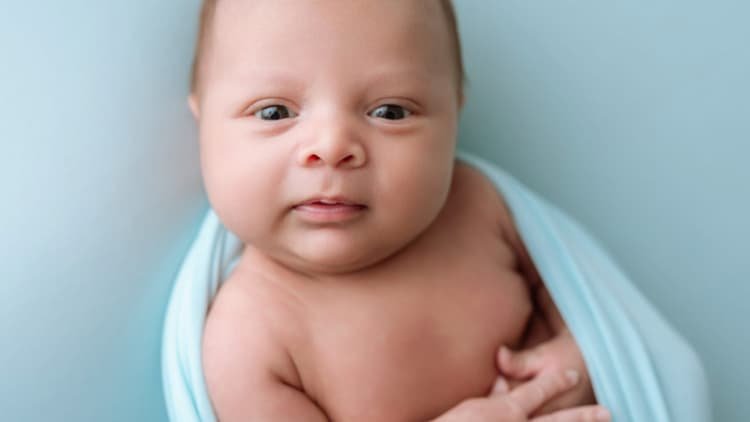 A newborn baby during the earliest stage of life when patterns of attention begin to emerge